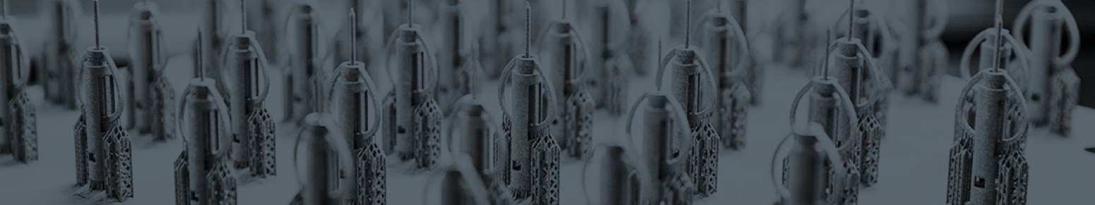 a metal 3D printing technician removes support structures from a DMLS part